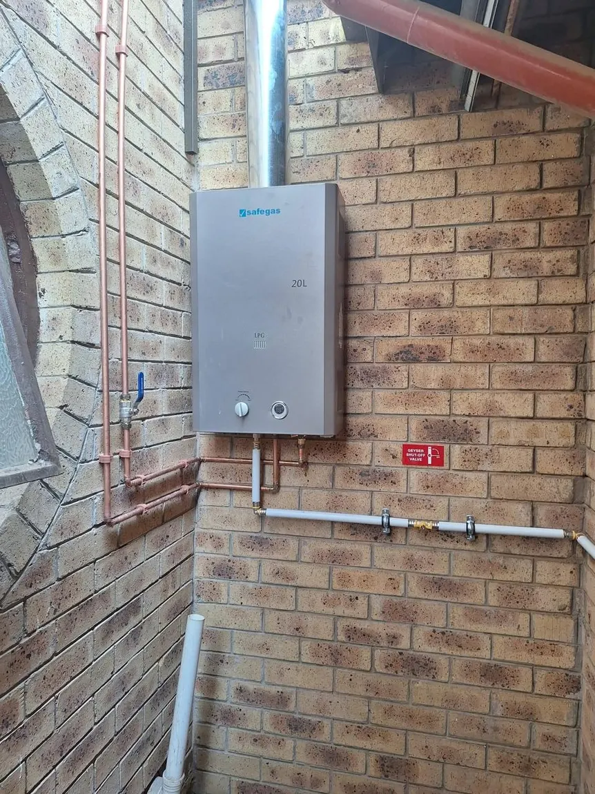 20 litre gas geyser installation on brick wall