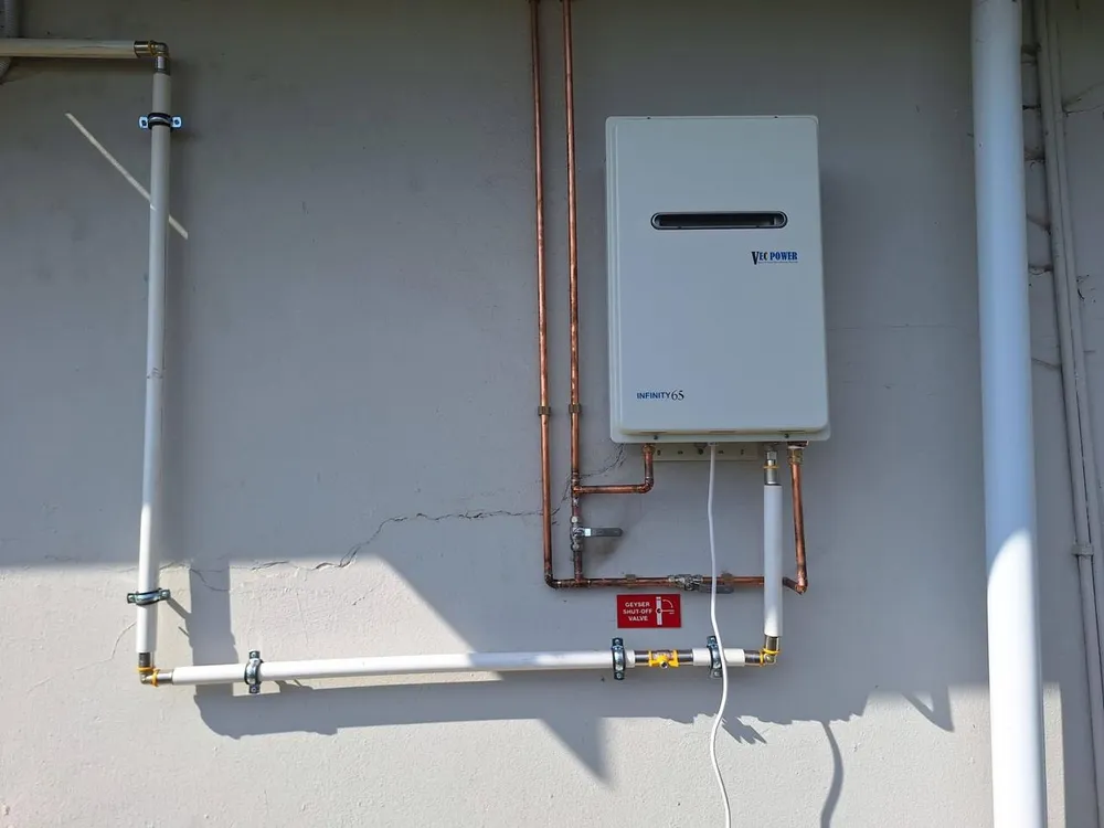 Gas geyser with shut-off valve and safety signage